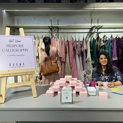 Here I am at my bespoke calligraphy station for the Kalki Fashion store launch in Bangalore. I love creating these interactive experiences where guests can get jewelry caskets and other items personalized live.