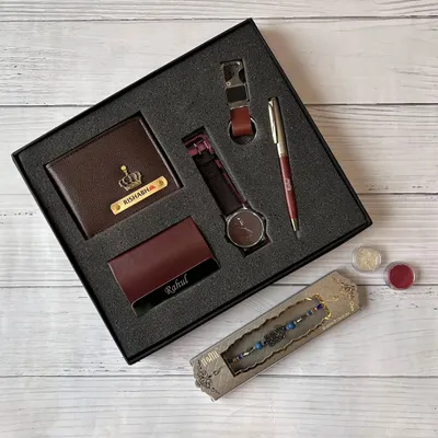 A classic and sophisticated gift set for men. This hamper includes a personalized wallet, watch, pen, cardholder, and keychain, all neatly arranged in a premium gift box.