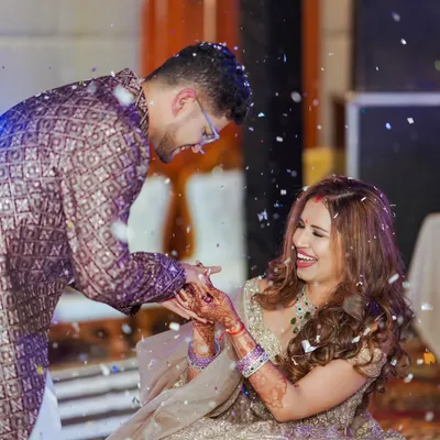 A moment of pure, unscripted laughter during an engagement ceremony. We aim to capture the genuine joy and connection between our couples.