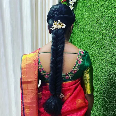 This is a classic fishtail braid, elevated with a traditional hair accessory. In my hairstyling module, you will learn various braiding techniques and how to choose the right accessories to match the client's saree and event.