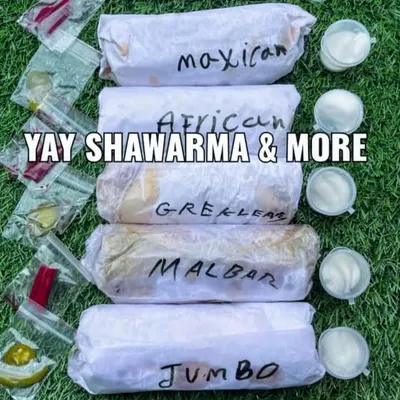 A top-down view of my signature fusion shawarma lineup. Each roll is clearly labeled so you can see the Mexican, African, Greek, and Malabar options, along with the extra-large Jumbo roll.