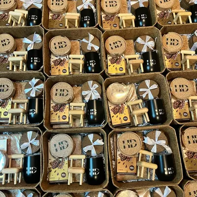 A large order of sustainable gift sets prepared for HD, featuring branded cork coasters and custom tumblers. This shows my capability to deliver unique, eco-friendly gifts in bulk.
