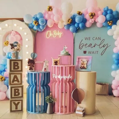 A beautiful 'We Can Bearly Wait' baby shower setup. The combination of pink and blue balloons, a light-up arch, and 'BABY' blocks creates a perfect backdrop for celebrating the parents-to-be.
