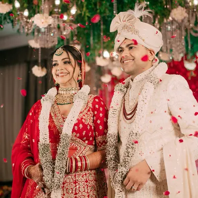 The magical moment of the varmala ceremony, showered in petals and blessings. We capture the pure joy and radiance of the couple as they officially begin their life together.