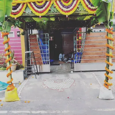 A classic entrance for a housewarming ceremony. We use banana plant pillars, a traditional coconut leaf canopy, and marigold garlands to create a welcoming and sacred space for your guests.