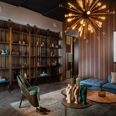 Bookshelves can be a key element of interior decor. We designed this special library unit to create a cozy reading nook, fabricating it in a combination of antique bronze finish metal and rich wood veneer.