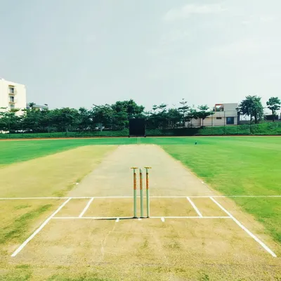 This is the standard of quality you can expect from our cricket ground rentals. A clear view of a professionally curated pitch with marked creases, ready for a competitive match.