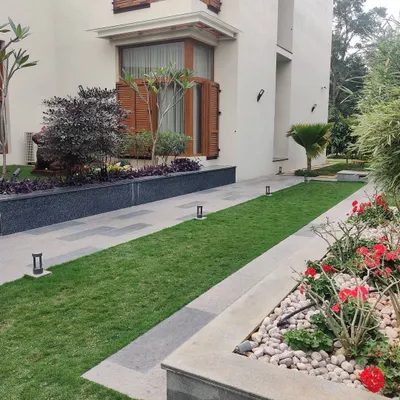 A carefully manicured garden path in one of our urban residential projects. We design landscape spaces that are both visually pleasing and functional, encouraging residents to spend more time outdoors.