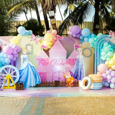 A magical Disney Princess stage set against a beautiful outdoor backdrop, featuring Cinderella, Elsa, Belle, and a stunning castle centerpiece for a truly royal celebration.