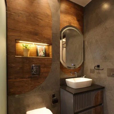 In this washroom from the Monochrome Oasis project, I used a combination of stone-look and wooden tiles in a semi-circle pattern to add warmth and visual interest.