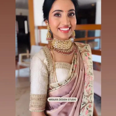 A happy client ready for a wedding. I designed this custom embroidered blouse to pair with her beautiful floral saree, creating a soft and elegant look.