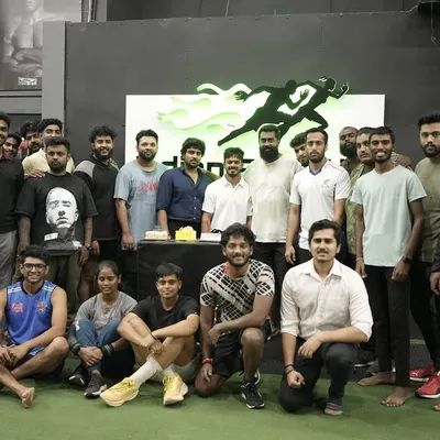 This is our tribe. A candid moment with our athletes and coaches celebrating together at our gym. We are more than just a training center; we are a community that supports each other through the daily grind and celebrates every victory, big or small.