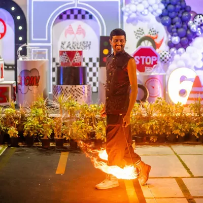 Let's heat things up! This incredible fire dancer made for a truly "lit" moment at the race car party. This kind of high-energy entertainment is perfect for wowing older kids and adults.