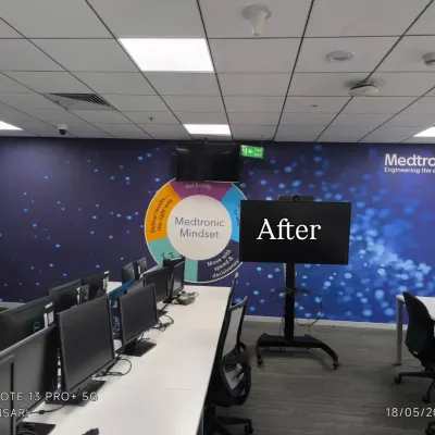 The 'after' shot of a Medtronic office, where I installed a large, branded "Mindset" mural to energize the workspace.