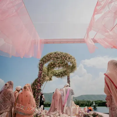 A breathtaking Anand Karaj ceremony at Raffles Udaipur. The pastel floral mandap, set against the serene lake and hills, created a truly heavenly atmosphere for the couple's vows.
