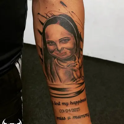 A touching memorial portrait tattoo for a client's mother. We specialize in capturing likeness and emotion to create a lasting tribute that keeps their memory alive.