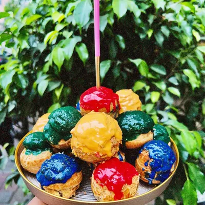 Here’s your sign to skip the cake and go for a tower of cream-filled happiness instead. My choux pastries are available in multiple flavors and make for a fun, colorful centerpiece.
