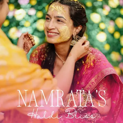The Haldi glow is real. This beautiful close-up captures the bride's blissful smile as her family applies the sacred turmeric paste.