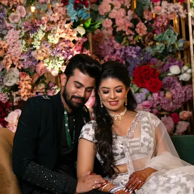 A quiet, loving moment between the happy couple. Prer's radiant makeup looks flawless and natural, capturing her 'lit-from-within' glow even in a soft, romantic setting.