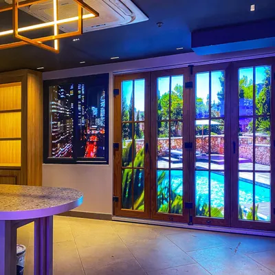 A key feature of the Weatherseal experience center. We created these window and door displays with interchangeable, backlit scenes, allowing customers to see how the products look against a city nightscape or a sunny poolside.