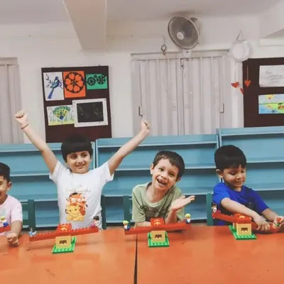 The pure joy of learning. These happy students are celebrating the seesaws they built, a fun project about balance and levers.