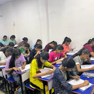 A classroom full of students deeply focused during their first preliminary examination. We believe consistent practice is the key to conquering exams and achieving excellent SSC results.