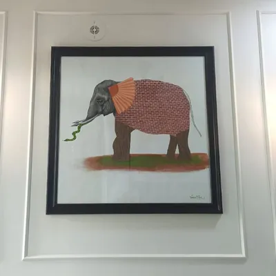 The 'Six Blind Men and an Elephant' painting, framed and displayed on a client's wall. It’s incredibly rewarding to see a conceptual piece that I created become a part of someone's home decor.