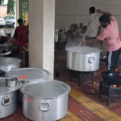 Behind the scenes of a bhandara for 1500 people. This shows the large-scale cooking in huge pots, which is necessary to feed such a large crowd.