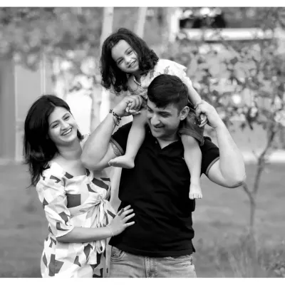 A happy family enjoying a day out in the park. I love capturing these relaxed, candid moments, like a daughter enjoying a shoulder ride from her dad.