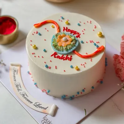 Our special Rakhi Mini Cake, decorated with an edible rakhi design. It's a sweet and thoughtful way to celebrate the bond between siblings, complete with a fondant message of "Forever Tied, Forever Loved."