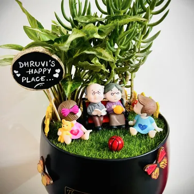 This one is so special to me. It was a gift for a toddler from her grandparents, showing them all together in their happy place. I love creating these little scenes that capture so much love in a beautiful succulent garden.