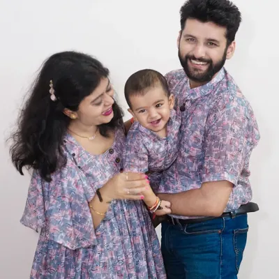 I love it when families coordinate their outfits. This beautiful family portrait showcases their happy connection.