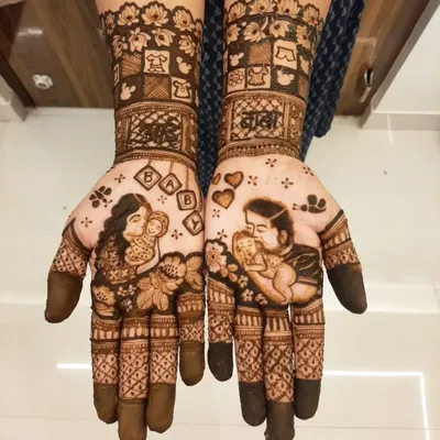 A complete baby shower story on hands, with portraits of the mother and father kissing the baby. The design includes 'aai-baba' in Marathi script and cute baby-themed blocks.