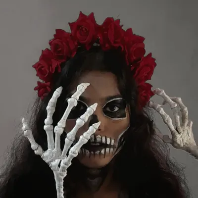 The Calavera Catrina look is all about the details. Here, the skeleton hands frame the face, adding to the spooky and artistic vibe. This kind of costume styling is perfect for making a huge impact at a theme party.