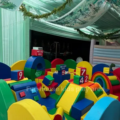 A close-up of our vibrant rainbow soft play setup, packed with colorful foam blocks, climbers, and slides for endless fun.