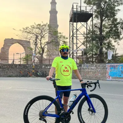 A solo shot with the majestic Qutub Minar at sunrise. Our heritage rides allow you to experience Delhi's history in a completely new light.