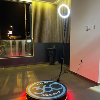 A close-up of the 360 platform and the professional ring light I use. The platform features built-in LED lighting for extra flair, while the main light ensures every video is bright, clear, and flattering for your guests.