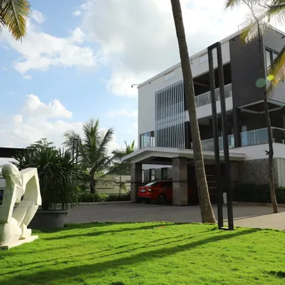 A pristine lawn in front of a modern home. My comprehensive turf care service ensures the grass remains dense, green, and perfectly manicured, enhancing the property's overall look.