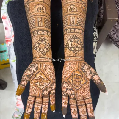 A classic full-arm bridal design featuring palace architecture at the top. The palms are adorned with a beautiful peacock and a personalized initial, blending royal motifs with a personal touch.