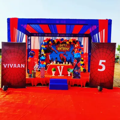 This Spiderman themed birthday party shows our complete execution. We built the stage, designed the backdrop, arranged the tent, and provided custom banners with the birthday boy's name and age.