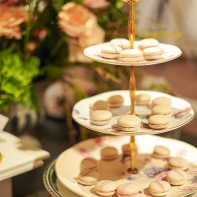 A three-tiered stand of our delicate raspberry and vanilla macarons. These were a highlight at a recent fashion event, adding a touch of Parisian elegance to the dessert selection.