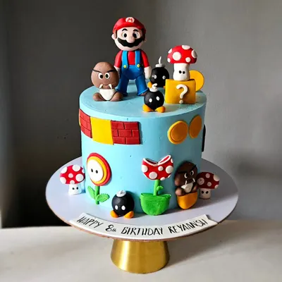It's-a-me, Mario! This Super Mario themed cake is packed with detail, featuring handcrafted figurines of Mario, Goombas, piranha plants, and question blocks. It took hours to create all these iconic, edible elements.