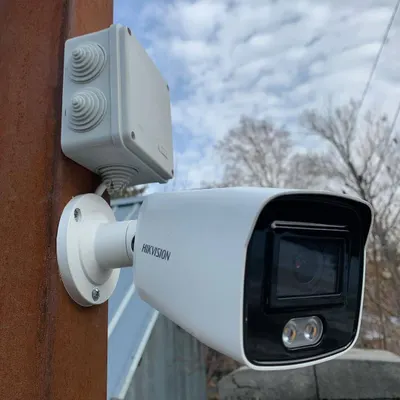 A professionally installed Hikvision bullet camera with a weatherproof junction box. This setup protects the connections from rain and dust, ensuring your security system works reliably in any weather.