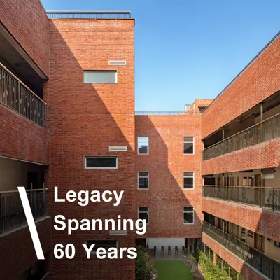 For 60 years, we have created architecture that responds to the needs of today while anticipating the challenges of tomorrow. This image of the HRM Global School, with its enduring brick facade, represents our long-standing legacy in educational design.