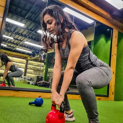 Here I am working on my form with a kettlebell sumo squat. I practice what I preach, focusing on strength and proper technique in my own workouts and for my clients.