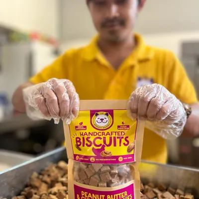 Here's a look at my Peanut Butter & Chicken Cookies, a unique combination of savory and nutty flavors that dogs love. Each biscuit is packed in a resealable pouch to maintain its crunch.