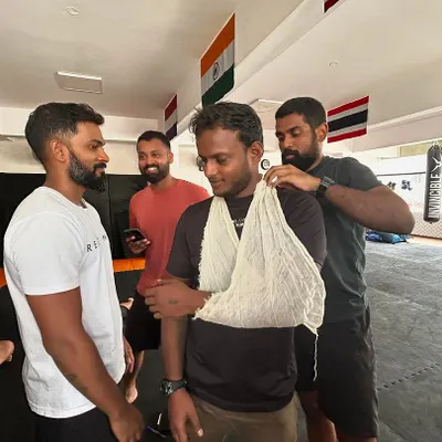 Learning how to properly apply a sling for an arm injury. Practical skills like this are crucial.