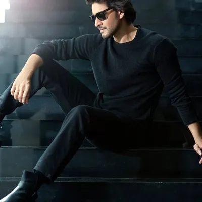 A moody, backlit portrait of actor Mahesh Babu for Hello! Magazine. The strong silhouette and minimalist all-black styling create a sense of modern, understated power.