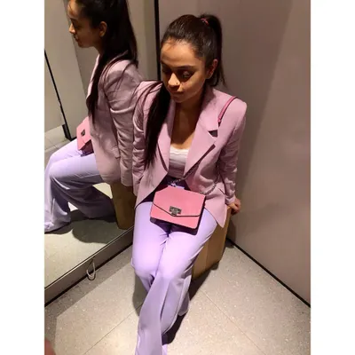 A perfect example of taking corporate wear Up-A-Notch with a monochrome look. This ultra-violet suit plays with different tints and shades of the same color, creating a chic, powerful, and fashion-forward office ensemble.