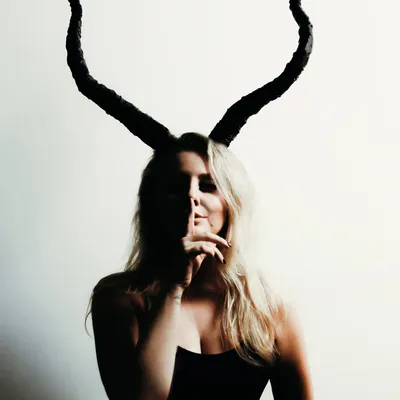 A creative shot for my birthday, embracing my Capricorn identity. This photo captures the darker, more artistic side of my brand.